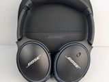 a pair of bose bluetooth headphones sitting on top of a black case