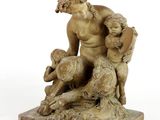 statue of a man with two children and a dog on a marble base