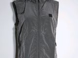 the vest is made of plastic and has a hood on it