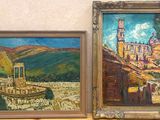 two paintings of a castle and a boat on a table