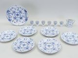 blue and white porcelain dishes and cups and saucers on a table