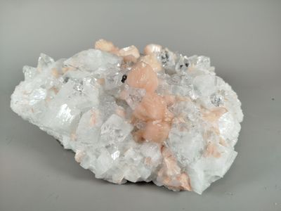 a small piece of rock with a teddy bear on top of it