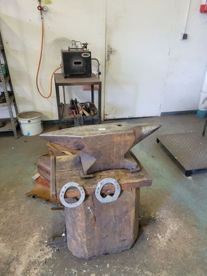 a wooden box with a pair of scissors on top of it