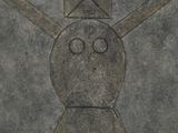 cement with a drawing of a man with a hat and a crossbone on it