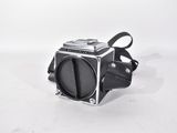a small camera that is sitting on a white surface