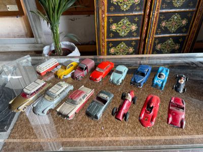 a lot of toy cars that are sitting on a table