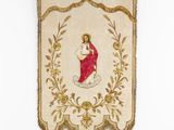 an embroidered banner with a woman holding a baby in her arms