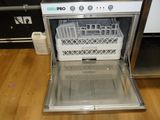 a dishwasher that is sitting in the middle of the floor