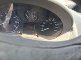 a close up of a car dashboard with a speedometer and gauges