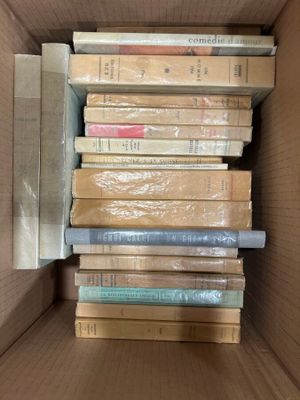 a box full of books sitting on a table