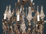 a chandelier that has a lot of glass hanging from it