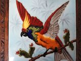 a picture of a bird that is painted on a tile