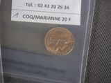 a gold coin sitting in a plastic bag on a table