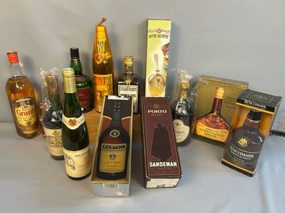 many different types of alcohol bottles on the table