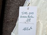 a label on a dress hanging on a hanger in a store