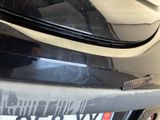 a close up of a car ' s bumper with a sticker on it