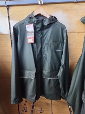 two jackets hanging on a rack in a store