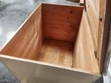 a wooden box that is sitting on the floor