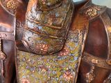 a statue of a horse with a saddle on it ' s back