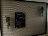 a sign on the wall of a restaurant that has a menu written on it