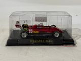 a model of a red car in a clear case