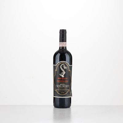 a bottle of red wine sitting on top of a table