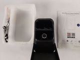 an image of a cell phone and a charger on a table