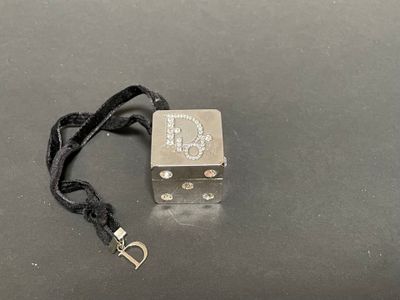 an image of a small metal object on a black surface