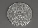 an image of a silver coin with a man ' s face on it