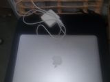 a laptop computer that is sitting on a table