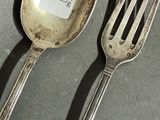 a fork and a spoon with a price tag on it