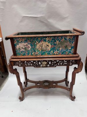 pair of antique wooden planters with floral designs on them