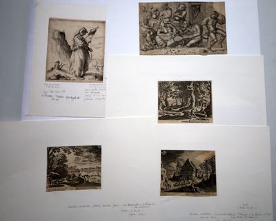 several drawings of people and animals are displayed on a white surface