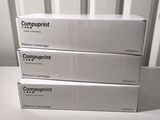 three boxes of computer equipment sitting on top of a white table