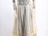 an image of a mannequin wearing a white dress with lace on it