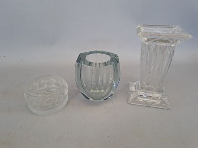 three glass vases sitting next to each other on a table