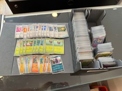a glass table with a lot of cards and papers on it