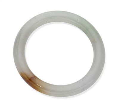 a picture of a white and brown ring on a white surface