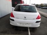 a white car that is parked in a parking lot