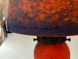 a lamp that has writing on it on it