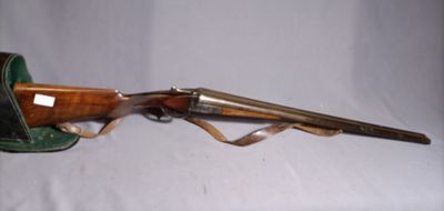 an old rifle with a leather case on a white background