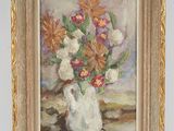 painting of a vase of flowers in a gold frame on a table