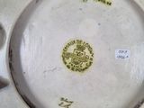 a close up of a white plate with a yellow label on it