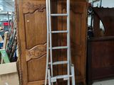 a ladder that is leaning against a cabinet in a room