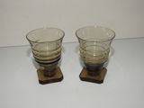 two glasses sitting on top of each other on a table