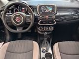 the interior of a small car with a steering wheel and dashboard