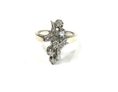 a close up of a diamond ring on a white background
