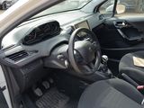 the interior of a small car with a steering wheel and dashboard