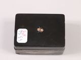 a small black box with a sticker on it