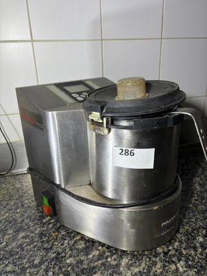 an image of a blender on a counter in a kitchen